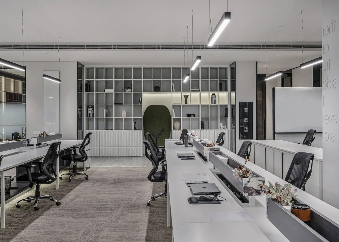 Modern open-plan office with linear LED ceiling lighting